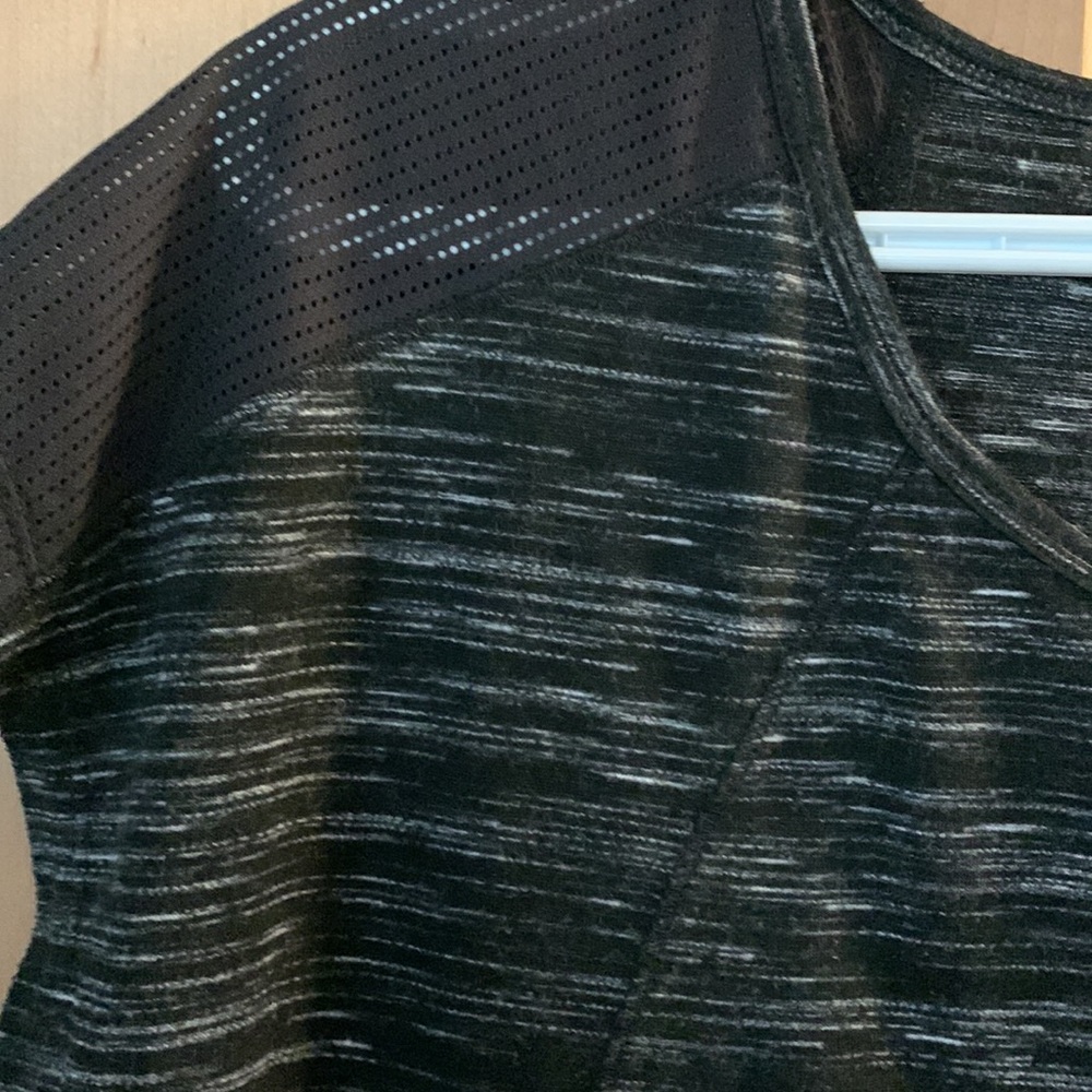 RBX black performance T-shirt mesh detail on shoulder and bottom back hem